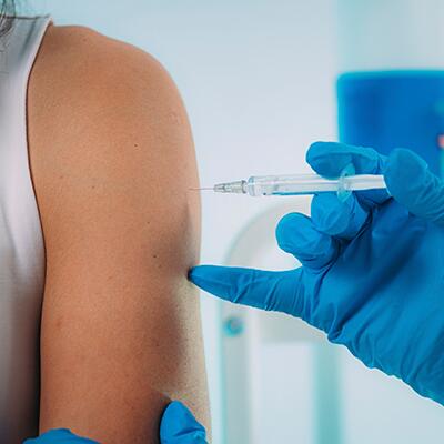 Person's arm getting shot